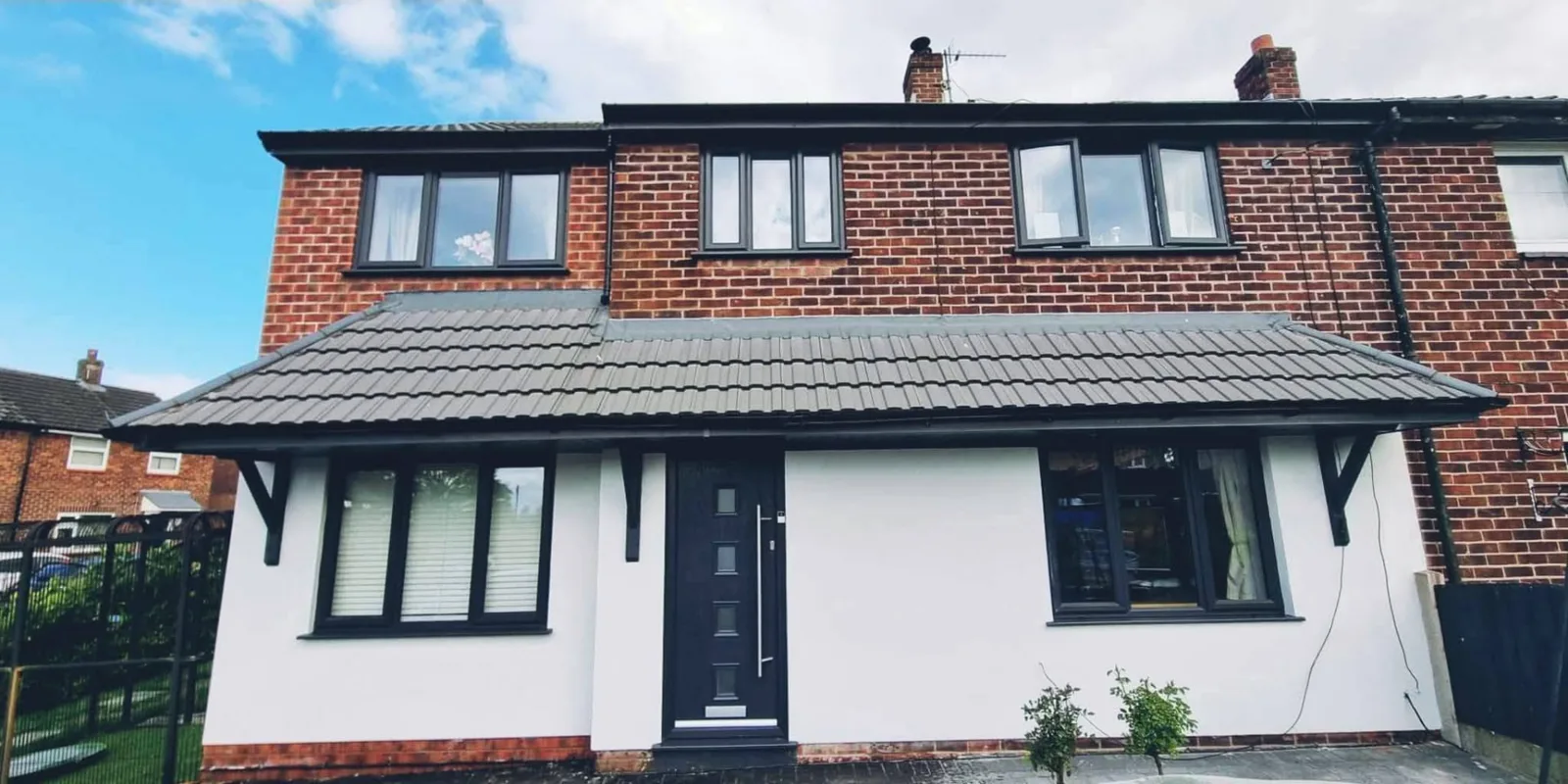 Semi-detached house after white rendering to the ground floor
